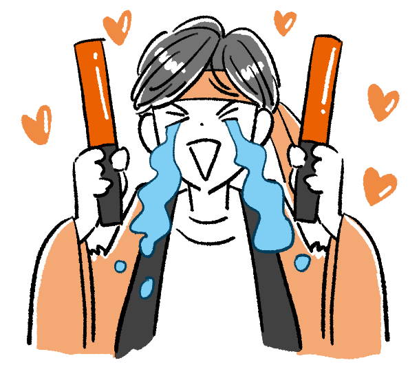 ペンライトを持って泣いて喜んでいる人